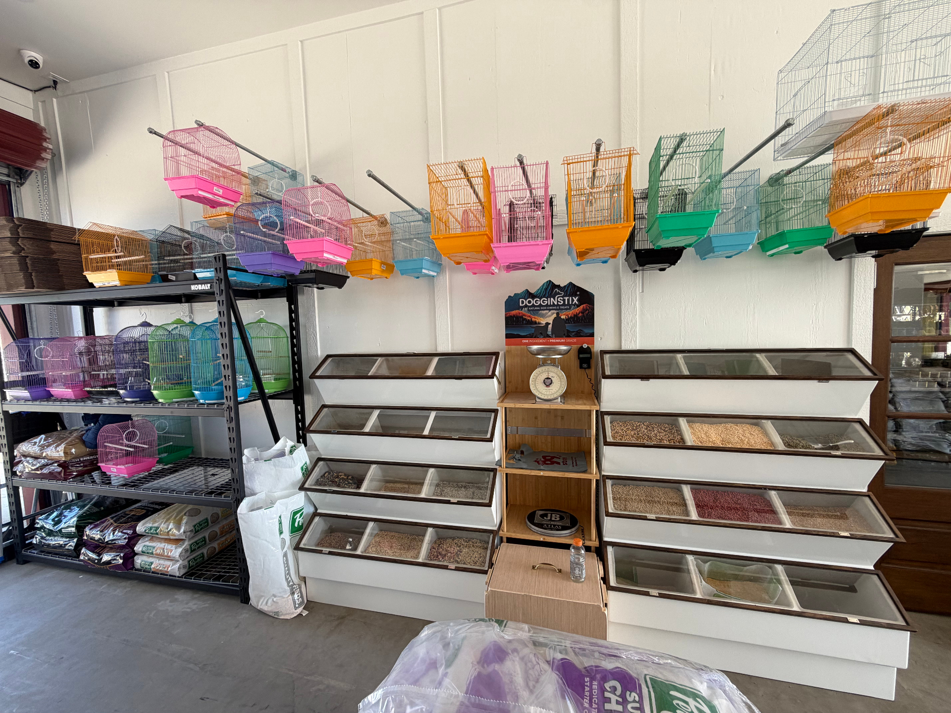 Bird cages and bulk seed bins